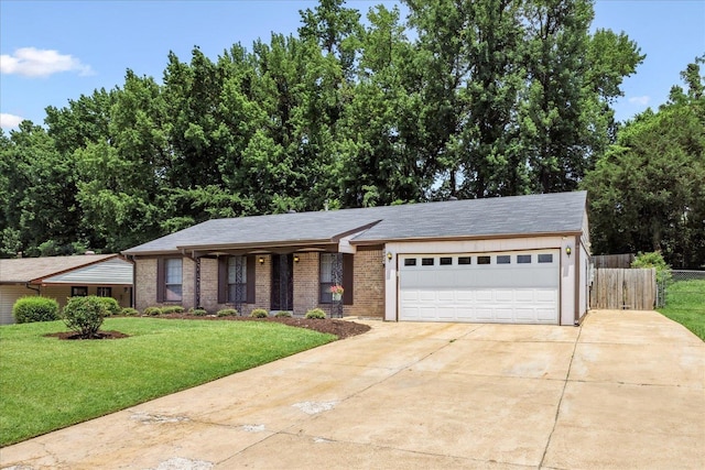 2826 Whitney Ave, Memphis, TN 38127 - view of front of property with concrete driveway, a garage, and brick siding