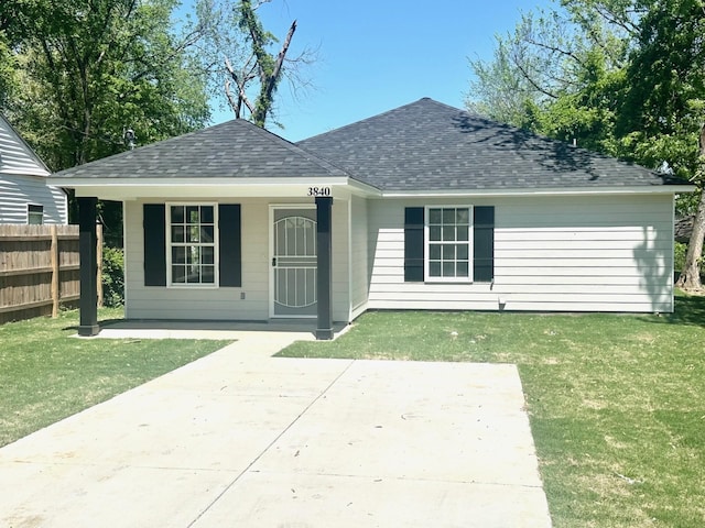 3758 Longfellow Rd, Memphis, TN 38108 - back of house featuring a shingled roof and covered porch