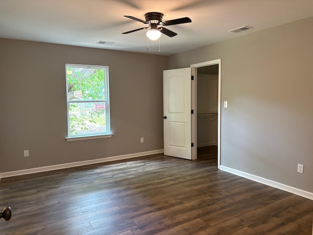 3758 Longfellow Rd, Memphis, TN 38108 - empty room with a ceiling fan and dark wood-style flooring