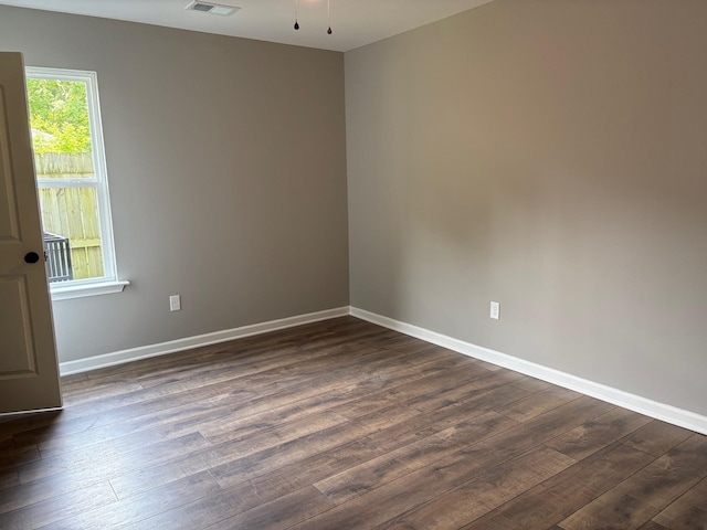 3758 Longfellow Rd, Memphis, TN 38108 - empty room featuring dark wood-type flooring and baseboards