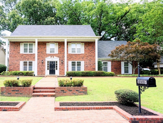 5587 S Ashley Sq S, Memphis, TN 38120 - view of front facade with a front lawn and brick siding