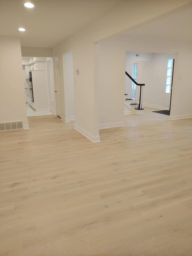 5587 S Ashley Sq S, Memphis, TN 38120 - empty room with recessed lighting, stairs, and light wood finished floors