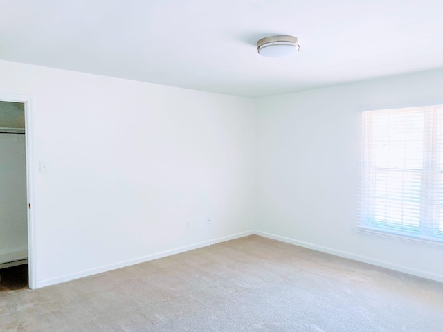5587 S Ashley Sq S, Memphis, TN 38120 - unfurnished bedroom with light colored carpet and a closet