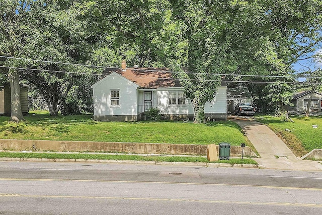 3267 Millington Rd, Memphis, TN 38127 - view of front facade featuring concrete driveway, a front yard, crawl space, and a chimney