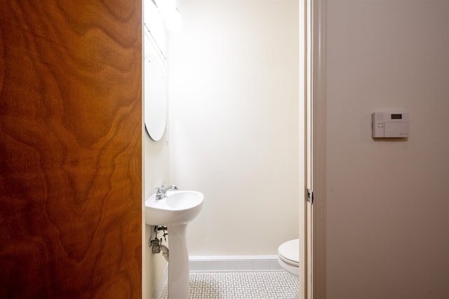92 S Main St Unit 103, Memphis, TN 38103 - bathroom featuring tile patterned floors and toilet
