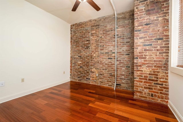 92 S Main St Unit 103, Memphis, TN 38103 - unfurnished room featuring a ceiling fan, wood finished floors, and brick wall