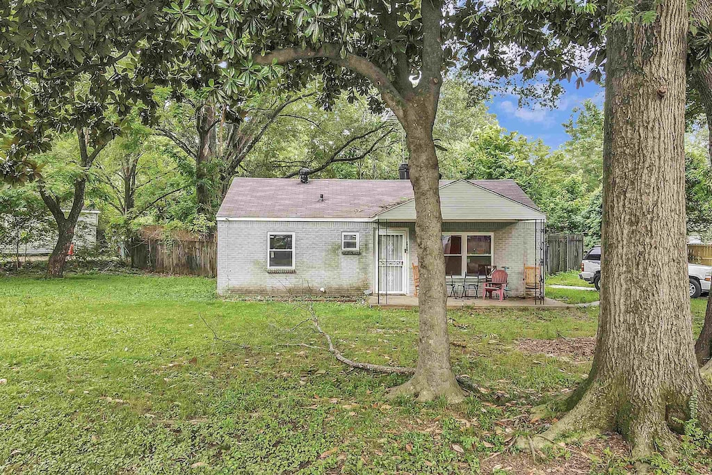 821 Restbrook Ave, Memphis, TN 38127 - rear view of house with brick siding and a patio area