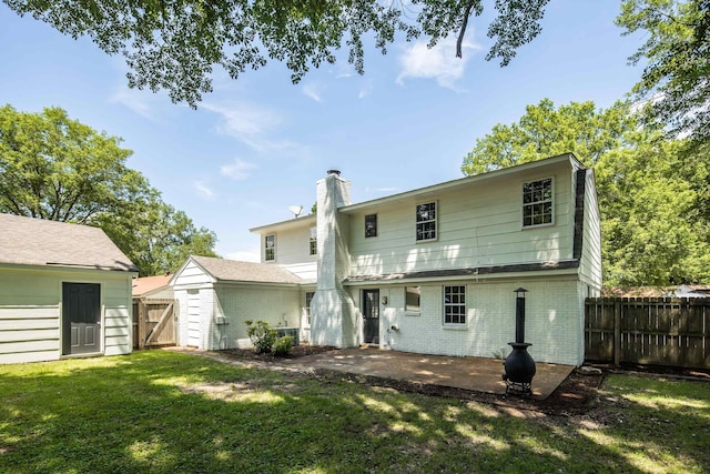 1149 Abbeville St, Collierville, TN 38017 - rear view of property with a chimney, brick siding, a fenced backyard, and a patio