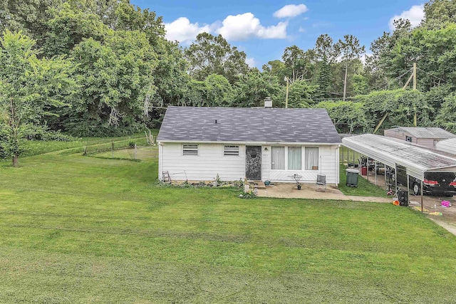 923 Joel Ave, Memphis, TN 38127 - view of front of house featuring a front lawn, a carport, and a chimney