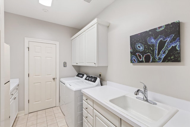 2912 Carnton Dr, Germantown, TN 38138 - laundry area featuring washer and dryer, cabinet space, and light tile patterned flooring