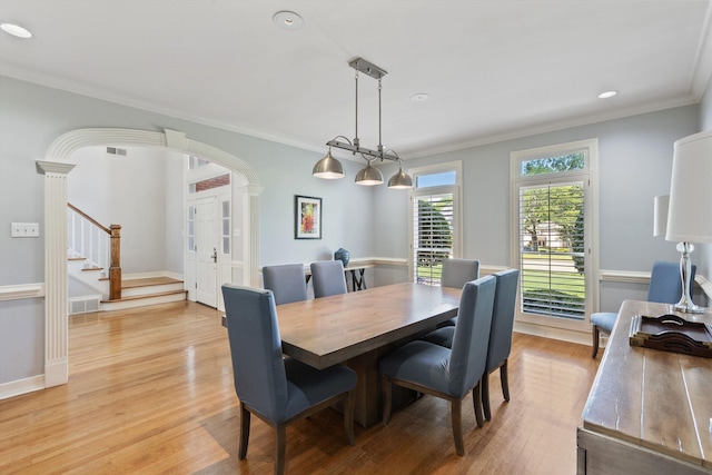 2912 Carnton Dr, Germantown, TN 38138 - dining space featuring light wood finished floors, stairway, arched walkways, ornamental molding, and recessed lighting