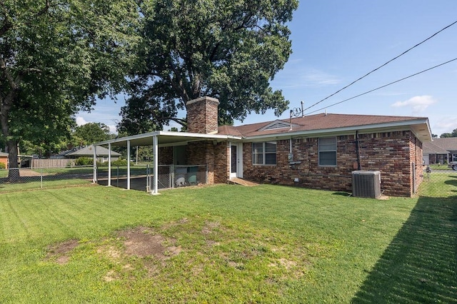 5153 Helene Rd, Memphis, TN 38117 - rear view of house with a chimney and brick siding