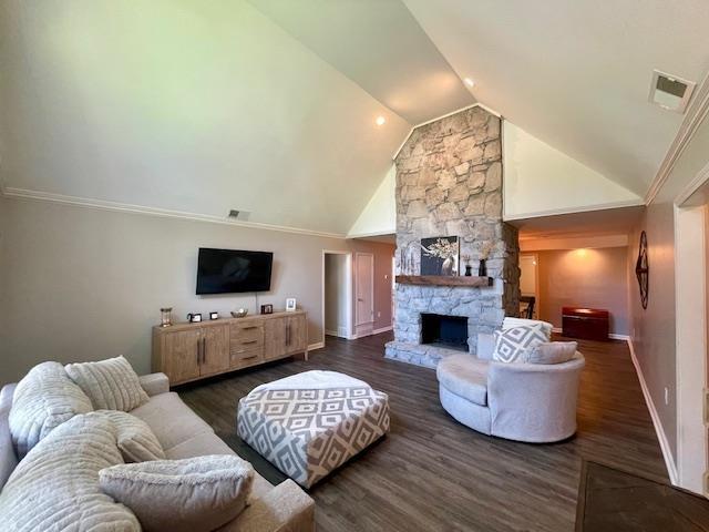 2470 S Flowering Tree Cv, Bartlett, TN 38134 - living area with wood finished floors, high vaulted ceiling, and a stone fireplace