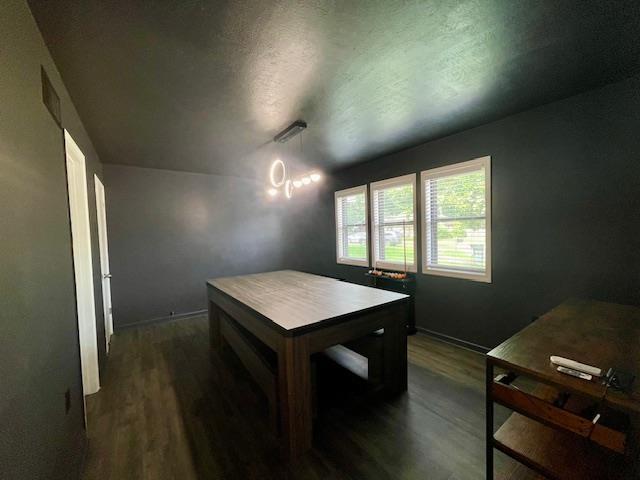 2470 S Flowering Tree Cv, Bartlett, TN 38134 - dining area featuring dark wood-style flooring and baseboards