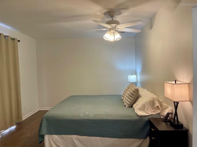 2470 S Flowering Tree Cv, Bartlett, TN 38134 - bedroom with dark wood-style floors and a ceiling fan