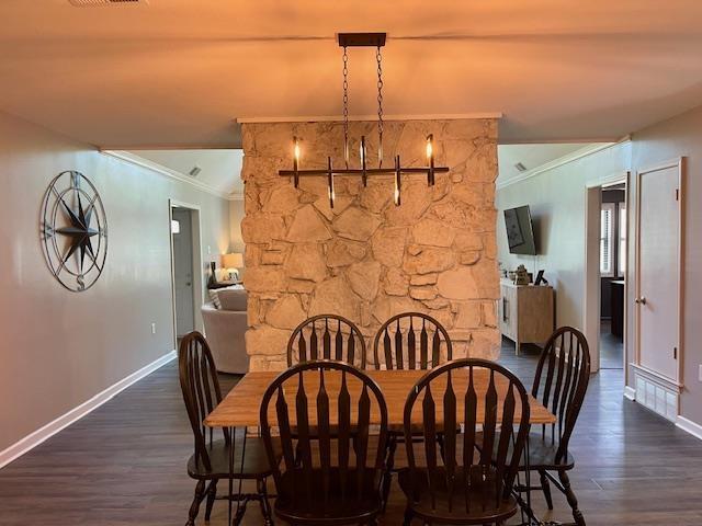 2470 S Flowering Tree Cv, Bartlett, TN 38134 - dining space with crown molding and dark wood-type flooring