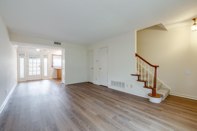 1204 Chamberlain Dr Unit 10, Memphis, TN 38119 - unfurnished living room featuring wood finished floors and stairs