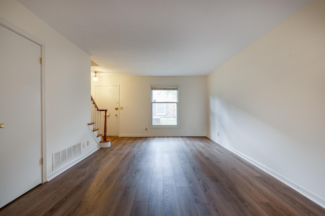 1204 Chamberlain Dr Unit 10, Memphis, TN 38119 - unfurnished living room with stairs and dark wood finished floors