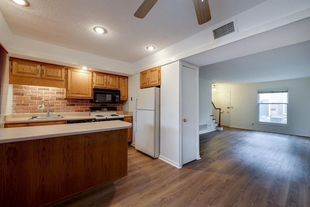 1204 Chamberlain Dr Unit 10, Memphis, TN 38119 - kitchen with white appliances, light countertops, a ceiling fan, a textured ceiling, and wood finished floors