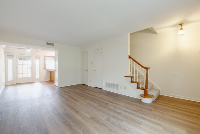 1204 Chamberlain Dr Unit 10, Memphis, TN 38119 - unfurnished living room with light wood-type flooring and stairway