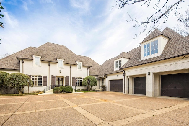 3217 Pointe Hill Cv, Memphis, TN 38125 - french country style house featuring driveway, brick siding, and a shingled roof