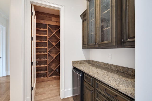 3217 Pointe Hill Cv, Memphis, TN 38125 - wine room with wine cooler, light wood-type flooring, and a dry bar