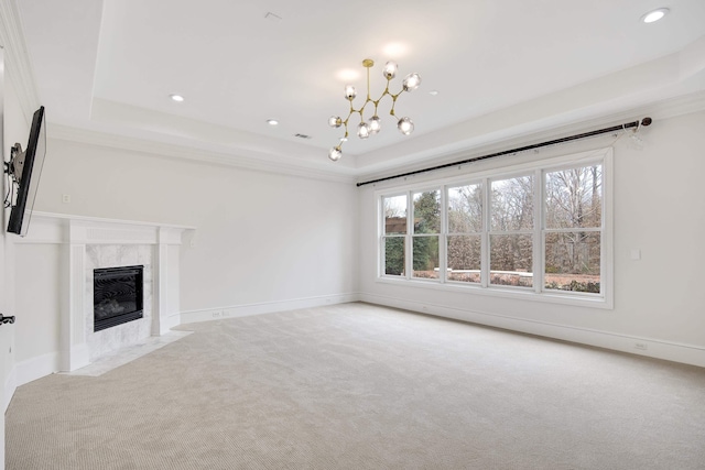 3217 Pointe Hill Cv, Memphis, TN 38125 - unfurnished living room with carpet flooring, a tray ceiling, a premium fireplace, a chandelier, and recessed lighting