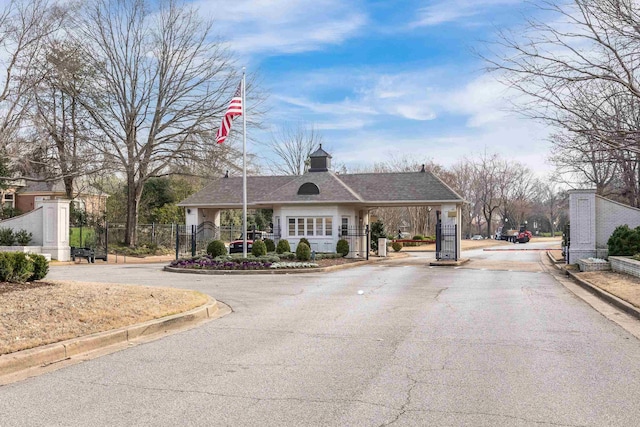 3217 Pointe Hill Cv, Memphis, TN 38125 - view of asphalt street featuring curbs and a gated entry