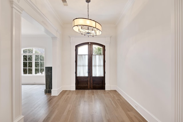 3217 Pointe Hill Cv, Memphis, TN 38125 - foyer featuring light wood-style floors, french doors, a chandelier, and crown molding