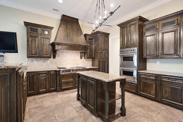 3217 Pointe Hill Cv, Memphis, TN 38125 - kitchen featuring custom exhaust hood, appliances with stainless steel finishes, backsplash, dark brown cabinets, and stone tile floors