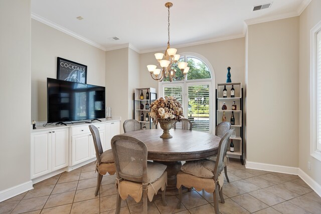 1426 Le Fleur Pl, Memphis, TN 38120 - dining area with a chandelier, light tile patterned floors, and ornamental molding