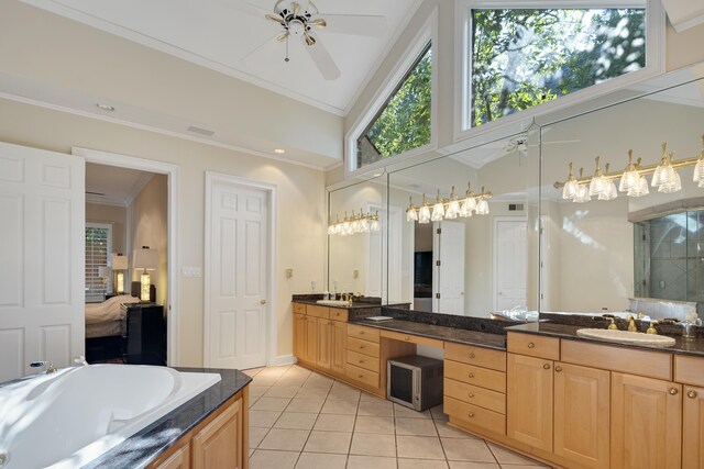 1426 Le Fleur Pl, Memphis, TN 38120 - bathroom featuring a ceiling fan, tile patterned floors, double vanity, ornamental molding, and connected bathroom