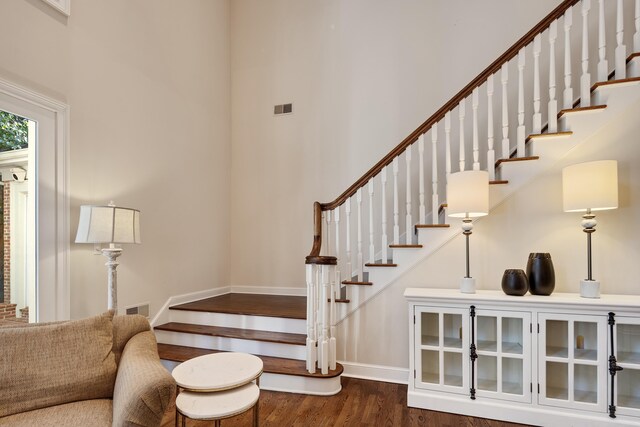 1426 Le Fleur Pl, Memphis, TN 38120 - staircase featuring a high ceiling and wood finished floors