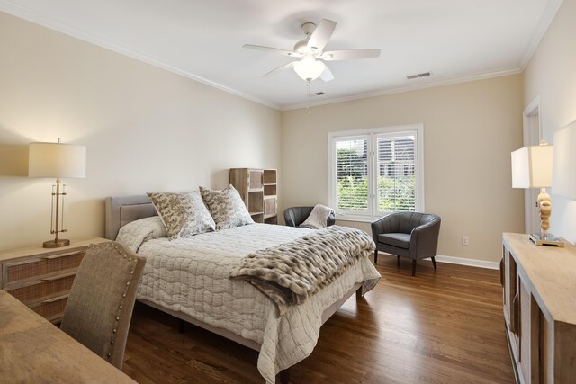 1426 Le Fleur Pl, Memphis, TN 38120 - bedroom with dark wood-type flooring, ornamental molding, and ceiling fan