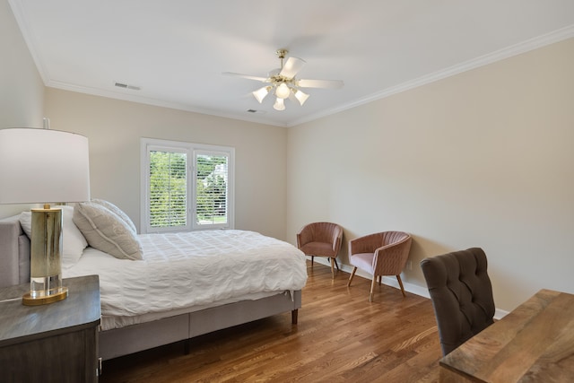 1426 Le Fleur Pl, Memphis, TN 38120 - bedroom with ornamental molding, wood finished floors, and a ceiling fan
