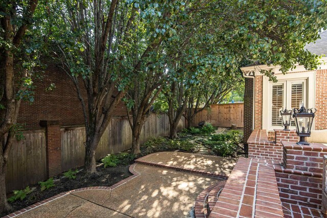 1426 Le Fleur Pl, Memphis, TN 38120 - fenced backyard featuring a patio