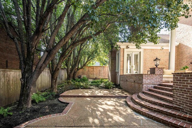 1426 Le Fleur Pl, Memphis, TN 38120 - fenced backyard featuring a patio