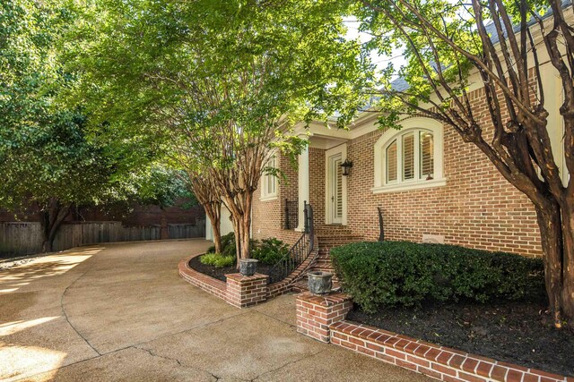 1426 Le Fleur Pl, Memphis, TN 38120 - view of front of property featuring brick siding and concrete driveway