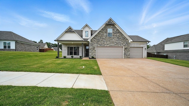 131 Pritchett Cv, Munford, TN 38058 - view of front of home featuring concrete driveway and stone siding