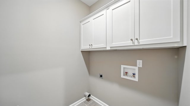 131 Pritchett Cv, Munford, TN 38058 - washroom with cabinet space, electric dryer hookup, washer hookup, and tile patterned flooring