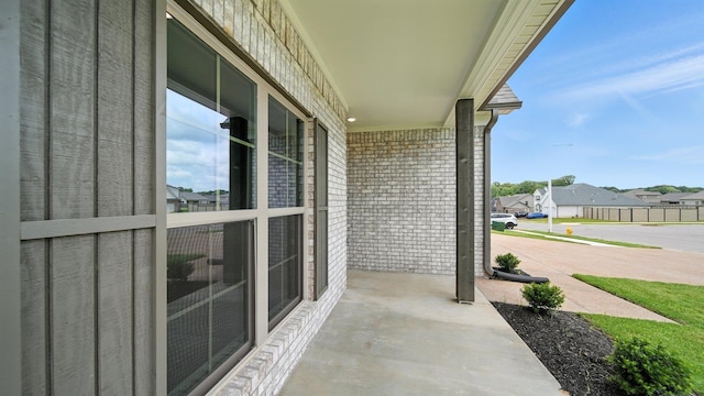 131 Pritchett Cv, Munford, TN 38058 - covered porch with a residential view