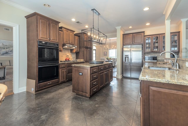 437 Duscoe St, Collierville, TN 38017 - kitchen featuring stainless steel appliances, backsplash, glass insert cabinets, a kitchen island, and light stone countertops