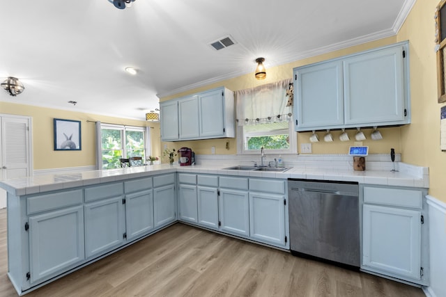526 Royal Pecan Way, Collierville, TN 38017 - kitchen with stainless steel dishwasher, a peninsula, tile countertops, light wood finished floors, and ornamental molding