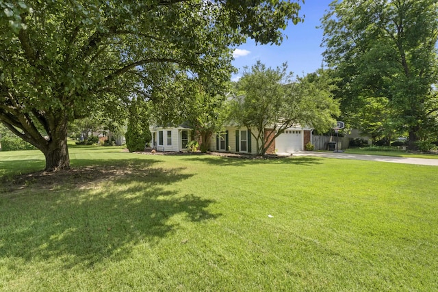 526 Royal Pecan Way, Collierville, TN 38017 - view of property hidden behind natural elements featuring concrete driveway, an attached garage, and a front lawn