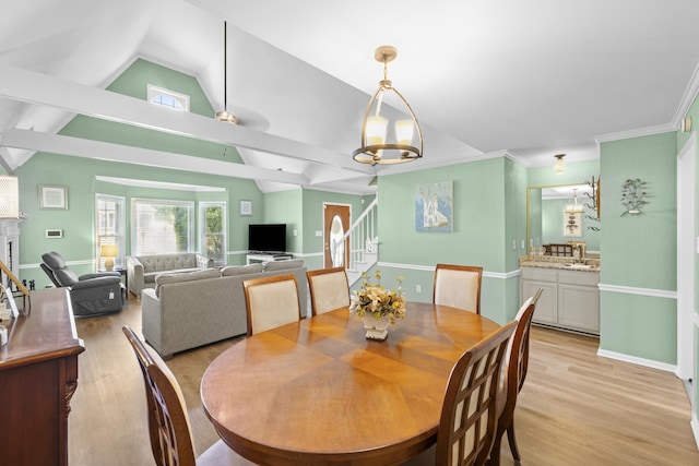 526 Royal Pecan Way, Collierville, TN 38017 - dining space featuring stairway, lofted ceiling, light wood-style flooring, and a chandelier