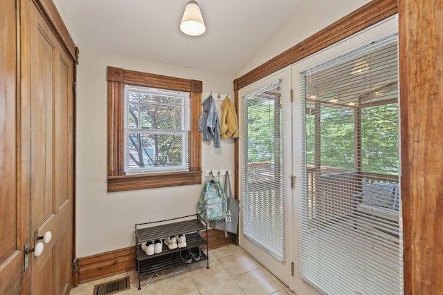 2198 Harbert Ave, Memphis, TN 38104 - doorway with lofted ceiling and light tile patterned flooring
