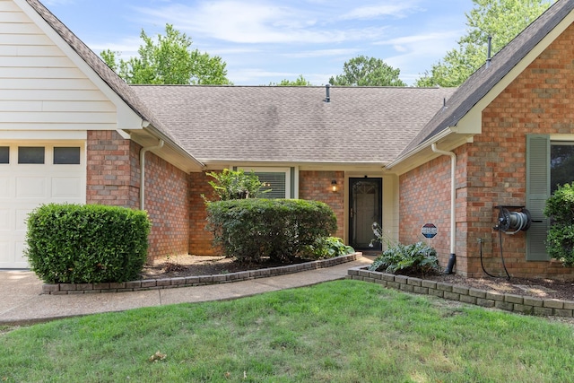 1504 Teal Wing Ln, Memphis, TN 38016 - view of front of property with a shingled roof, a garage, brick siding, and a front yard
