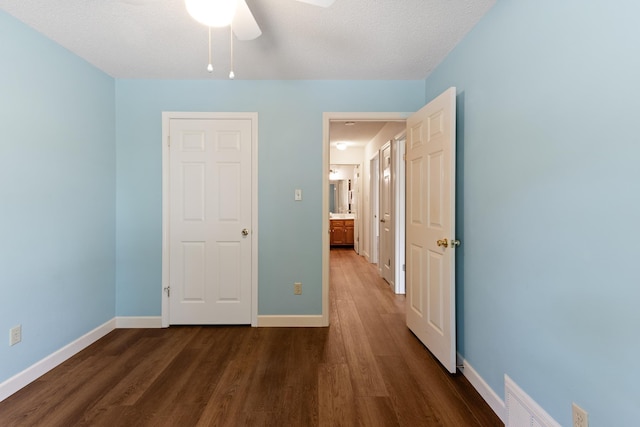 1504 Teal Wing Ln, Memphis, TN 38016 - unfurnished bedroom with dark wood-type flooring and a ceiling fan