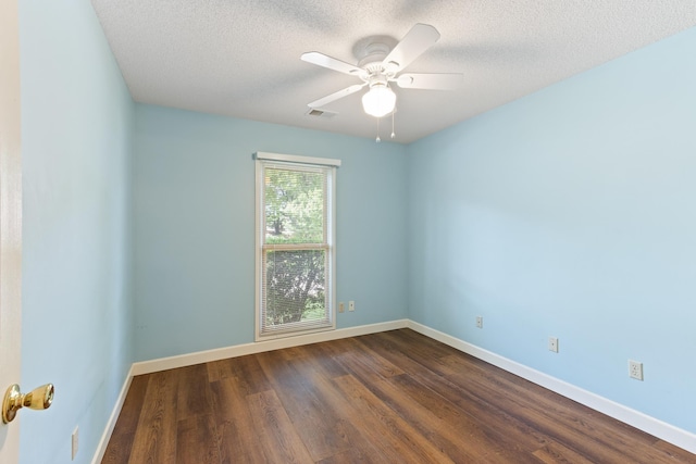 1504 Teal Wing Ln, Memphis, TN 38016 - empty room featuring dark wood-type flooring, a textured ceiling, and ceiling fan