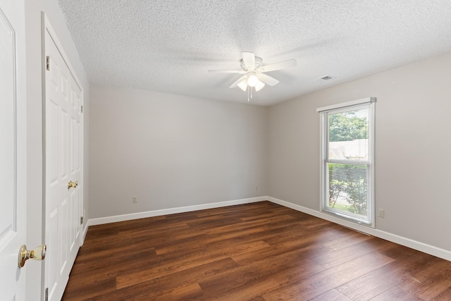 1504 Teal Wing Ln, Memphis, TN 38016 - unfurnished bedroom featuring dark wood-style floors, a textured ceiling, ceiling fan, and a closet
